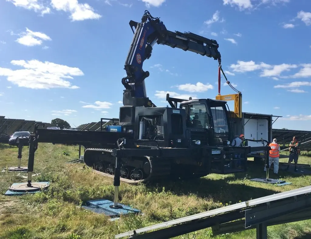 Tracked machine with crane